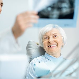 East Islip denture dentist explaining X-ray to patient
