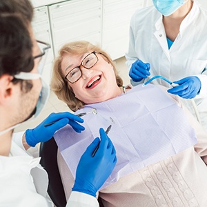 Senior woman smiling at dentist in East Islip