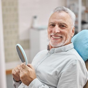 man smiling in dental chair  