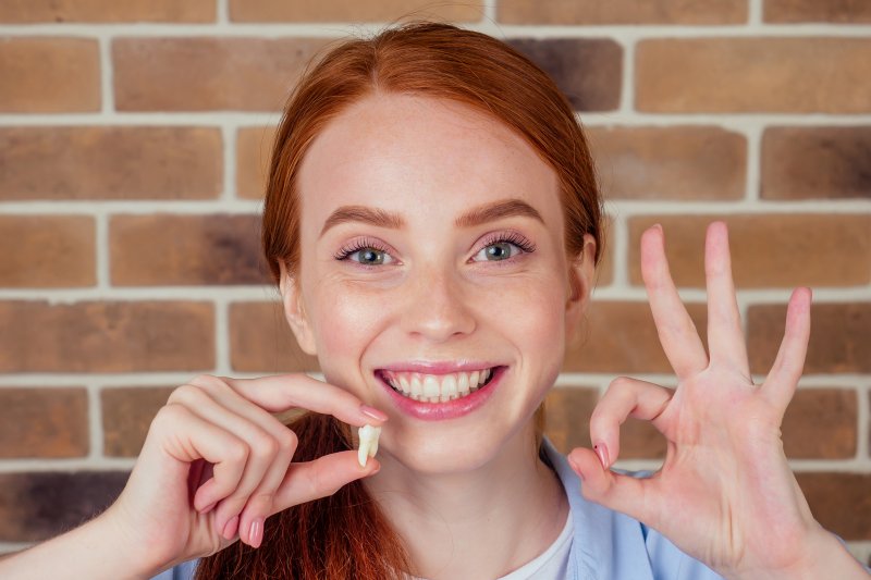 Girl holding wisdom teeth